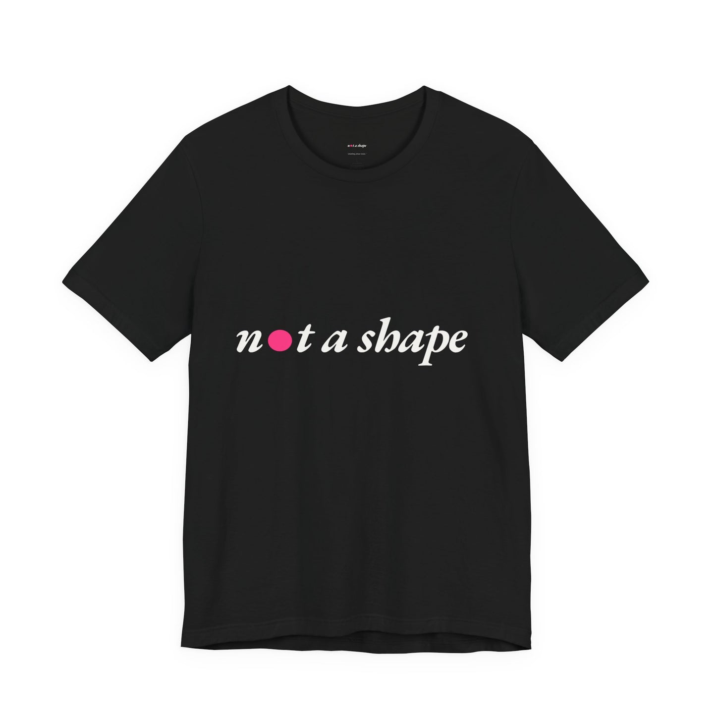 A black short-sleeve crewneck t-shirt with the phrase 'not a shape' printed across the chest in white script, where the letter 'o' is replaced by a small pink heart. The t-shirt is displayed flat against a solid white background.
