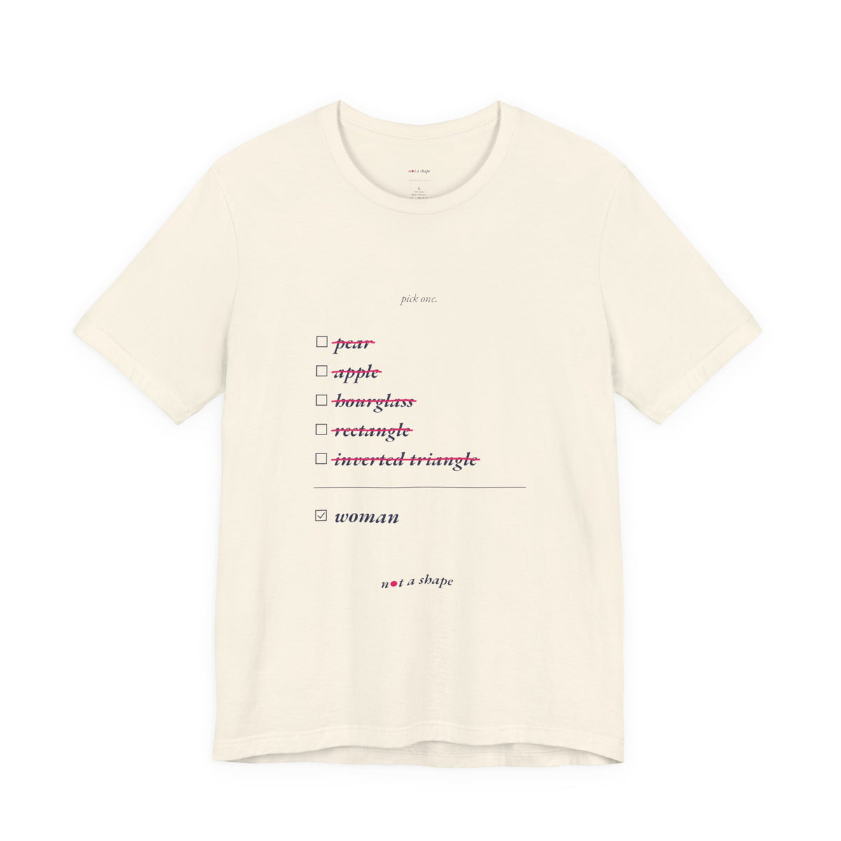 An off-white short-sleeve t-shirt with a minimalist checklist graphic on the front. The graphic features the word 'pick one' above a list of shapes and the word 'woman' in red and black text, with the brand 'we are shops' printed at the bottom.